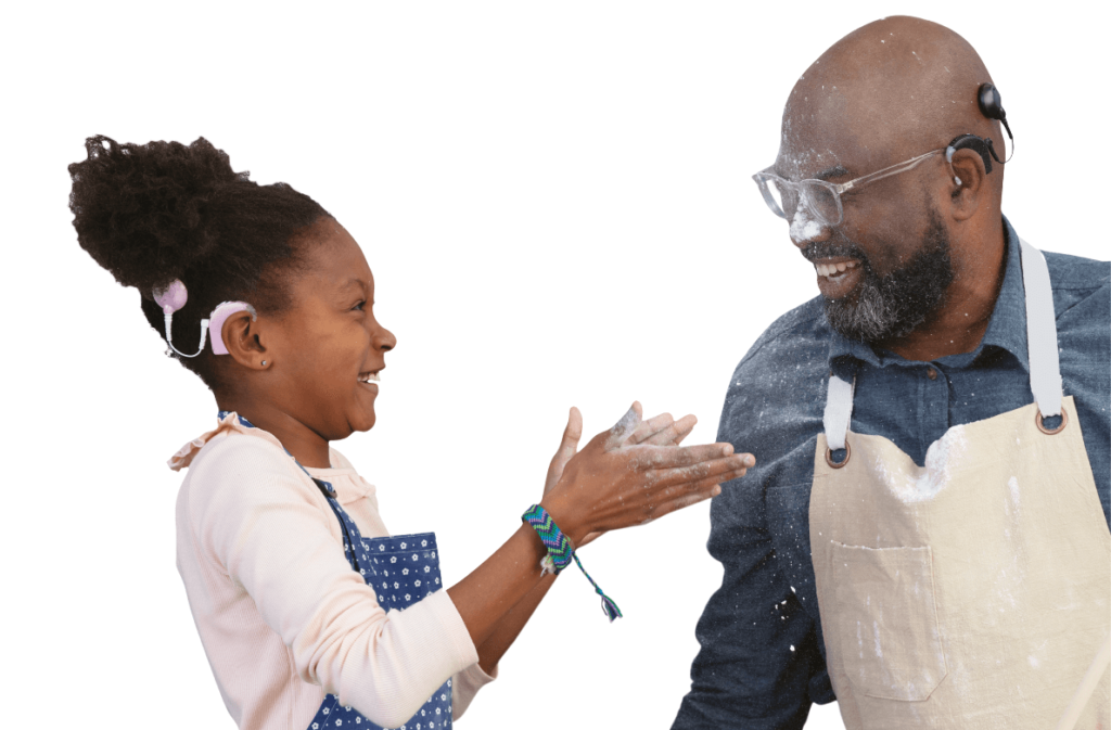 Girl and her father with a cochlear implant